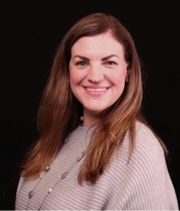 woman in sweater smiling